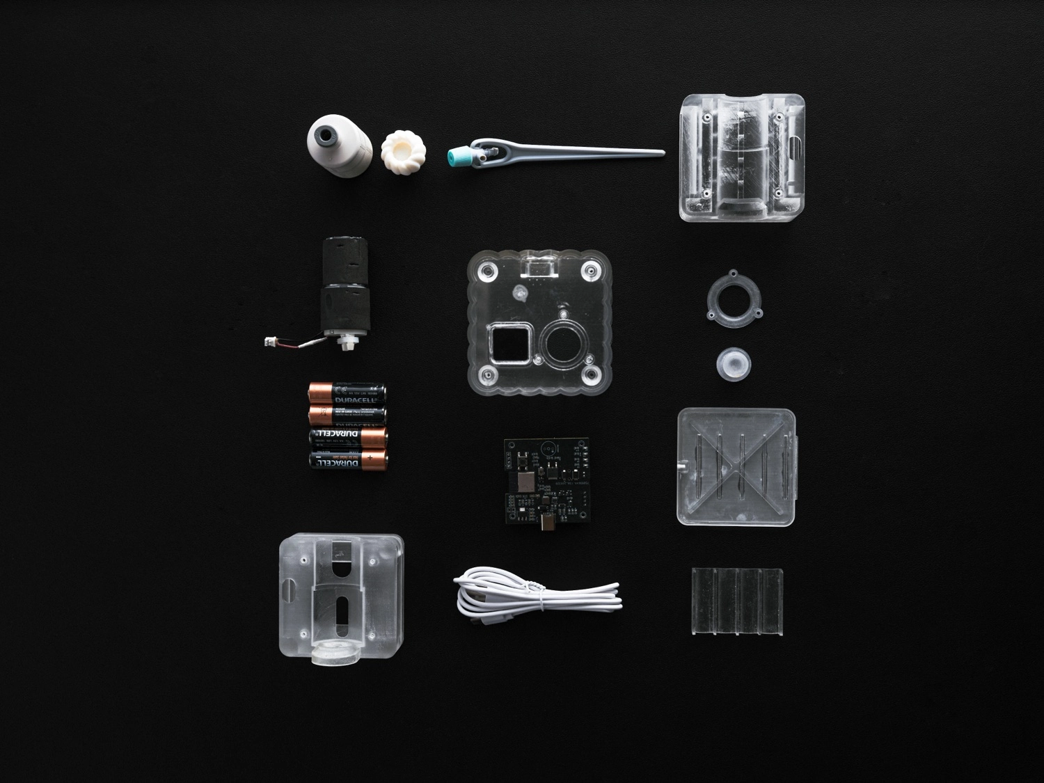 MP26-01 components laid out on a black surface