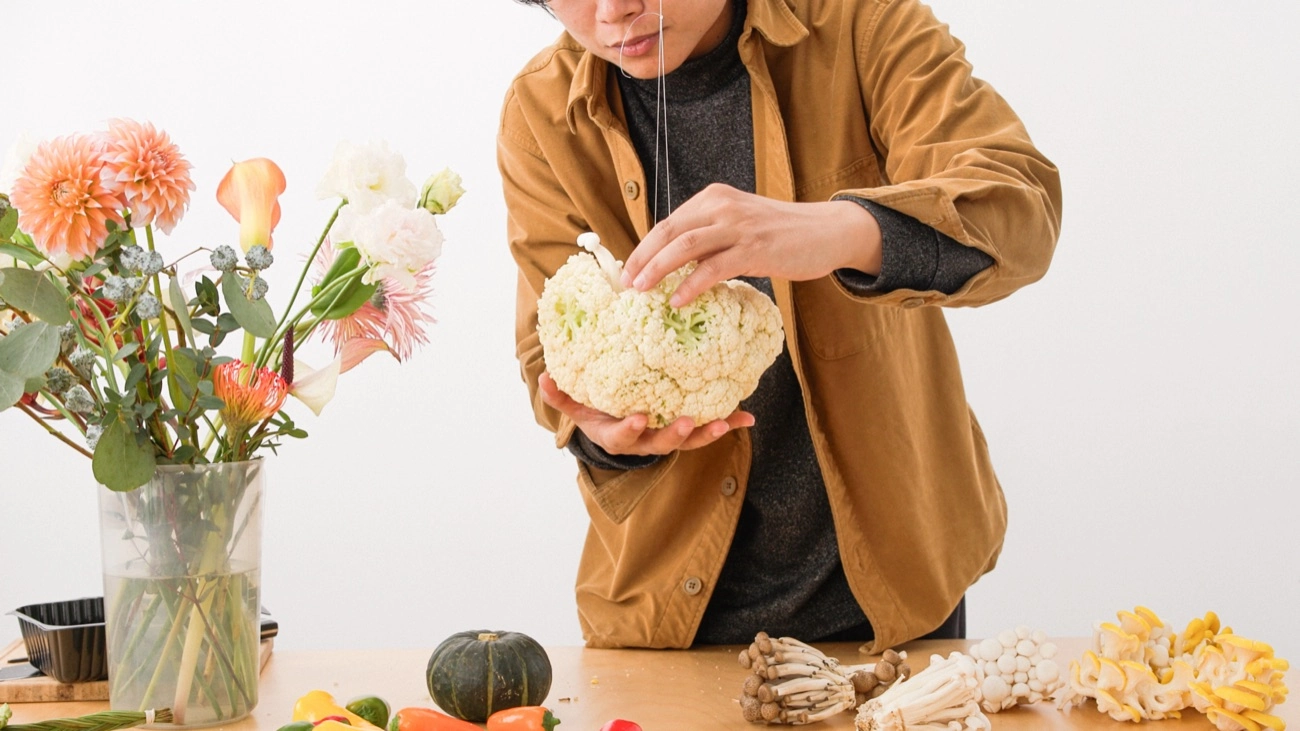 Designer testing irrigation in a vegetable arrangement